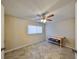Bedroom featuring tile floors, a ceiling fan, one window with blinds and a workbench at 2004 Berry Roberts Dr, Sun City Center, FL 33573