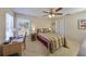 Bedroom featuring carpeted floors, a ceiling fan, one window and a desk at 2004 Berry Roberts Dr, Sun City Center, FL 33573