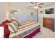 Bedroom featuring carpeted floors, a ceiling fan, one window, and dresser at 2004 Berry Roberts Dr, Sun City Center, FL 33573