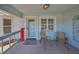 Inviting front porch with seating area and a bright, welcoming entrance at 2004 Berry Roberts Dr, Sun City Center, FL 33573