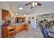 Open-concept space featuring a kitchen with bar seating, seamlessly flowing into the living area at 2004 Berry Roberts Dr, Sun City Center, FL 33573