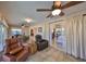 Cozy living area with access to a sunroom and bedroom, complete with comfortable seating at 2004 Berry Roberts Dr, Sun City Center, FL 33573