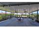 Enclosed patio with lots of seating, ceiling fans and string lights at 2004 Berry Roberts Dr, Sun City Center, FL 33573