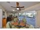 Relaxing sunroom with multiple seating areas and views of the outdoor patio at 2004 Berry Roberts Dr, Sun City Center, FL 33573