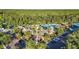 Beautiful aerial view of community clubhouse, pool, tennis courts, parking and lush landscaping at 20203 Merry Oak Ave, Tampa, FL 33647