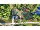 Aerial view of the community putting green with lush green grass, surrounded by beautiful trees and landscaping at 20203 Merry Oak Ave, Tampa, FL 33647