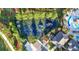 Aerial view of the community playground with swings, slides, and other play structures near the pool at 20203 Merry Oak Ave, Tampa, FL 33647