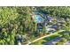 Community amenities with a pool, tennis courts, and playground amidst lush greenery, creating a vibrant community atmosphere at 20203 Merry Oak Ave, Tampa, FL 33647