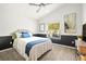 Comfortable bedroom with vaulted ceilings, a large window, stylish wainscoting, and carpeted flooring at 20203 Merry Oak Ave, Tampa, FL 33647