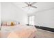 Inviting bedroom with a ceiling fan, large window, and charming decor creating a comfortable personal space at 20203 Merry Oak Ave, Tampa, FL 33647