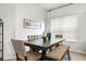 Bright dining room with a dark wood table, upholstered chairs, and stylish decor, ideal for formal meals at 20203 Merry Oak Ave, Tampa, FL 33647
