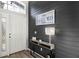 Stylish entryway featuring a shiplap accent wall, console table, and decorative accents, creating a warm welcome at 20203 Merry Oak Ave, Tampa, FL 33647
