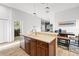 Spacious kitchen island with seating and a stylish sink, ideal for food preparation and casual dining at 20203 Merry Oak Ave, Tampa, FL 33647