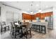 Open-concept kitchen and dining area with a table, breakfast bar, and modern appliances, perfect for Gathering gatherings at 20203 Merry Oak Ave, Tampa, FL 33647