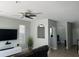 Cozy living room featuring modern decor and a seamless flow to the adjacent dining area at 2111 Park Crescent Dr, Land O Lakes, FL 34639