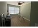 Home office with desk, chair, and window overlooking backyard at 2111 Park Crescent Dr, Land O Lakes, FL 34639