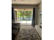 Lovely patio with lake view, accessible from the living room through sliding glass doors at 2111 Park Crescent Dr, Land O Lakes, FL 34639
