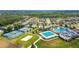 Extensive community amenities include pools, tennis courts, and lush landscaping, all surrounded by beautiful homes and mature trees at 21506 Snowy Orchid Ter, Land O Lakes, FL 34637