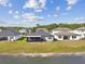 Aerial view of the backyard overlooking the lake, highlighting the proximity to the water and outdoor spaces at 21506 Snowy Orchid Ter, Land O Lakes, FL 34637