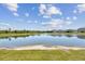 Scenic water view enhances this home, creating a serene backdrop for outdoor enjoyment and relaxation at 21506 Snowy Orchid Ter, Land O Lakes, FL 34637