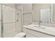 Modern bathroom showcasing a walk-in shower with white subway tile and vanity at 21506 Snowy Orchid Ter, Land O Lakes, FL 34637