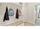 Functional mudroom with a bench, hooks, and storage, providing an organized space for coats and bags at 21506 Snowy Orchid Ter, Land O Lakes, FL 34637