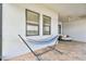 Relaxing outdoor space with hammock and lounge chair create a peaceful oasis on the brick-paved patio at 21506 Snowy Orchid Ter, Land O Lakes, FL 34637