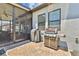 Outdoor grilling area with stainless steel grill and brick pavers, offering a convenient and stylish cooking space at 21506 Snowy Orchid Ter, Land O Lakes, FL 34637