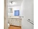 Compact bathroom featuring a vanity, sink, and towel bars for accessibility at 2231 Nichols Rd, Lithia, FL 33547