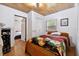 Cozy bedroom with wood-look floors, closet, and window with a view at 2231 Nichols Rd, Lithia, FL 33547