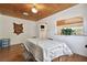 Cozy dining room features light-colored wood paneling, wood ceiling and hardwood floors at 2231 Nichols Rd, Lithia, FL 33547