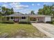Charming home featuring a covered carport, and well-maintained lawn and landscaping at 2231 Nichols Rd, Lithia, FL 33547