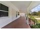 Inviting covered front porch, showing access to a covered carport at 2231 Nichols Rd, Lithia, FL 33547