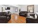 Inviting living room with wood flooring and dark furniture at 2231 Nichols Rd, Lithia, FL 33547