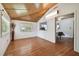 Inviting living room with wood-look floors, large windows, and an open layout at 2231 Nichols Rd, Lithia, FL 33547
