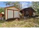 Exterior shot of the two outbuildings, offering storage and utility spaces at 2231 Nichols Rd, Lithia, FL 33547