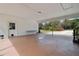 Large, covered patio area with ample space for entertaining or relaxing outdoors at 2231 Nichols Rd, Lithia, FL 33547