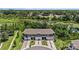 Aerial view showcasing the townhome community's proximity to lush greenery and serene water features at 23378 Papyrus Way, Lutz, FL 33549