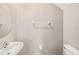 Half bathroom features a stylish sink and toilet at 23378 Papyrus Way, Lutz, FL 33549