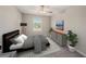 Cozy bedroom providing ample natural light, stylish furniture, and contemporary design at 23378 Papyrus Way, Lutz, FL 33549