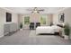 Comfortable bedroom showcasing neutral tones, plush carpeting, and large windows at 23378 Papyrus Way, Lutz, FL 33549