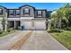 Charming townhome with a two-car garage and well-maintained landscaping in a desirable neighborhood at 23378 Papyrus Way, Lutz, FL 33549