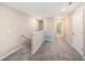 Upstairs hallway featuring carpet and view of other bedrooms at 23378 Papyrus Way, Lutz, FL 33549