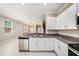 Well-equipped kitchen with stainless steel appliances and granite countertops, offering ample counter space at 23378 Papyrus Way, Lutz, FL 33549
