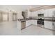 Bright kitchen featuring stainless steel appliances, granite countertops and ample cabinet space at 23378 Papyrus Way, Lutz, FL 33549