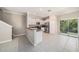 Bright living room features tile flooring, granite countertops and stainless steel appliances at 23378 Papyrus Way, Lutz, FL 33549