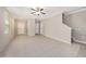Open living area with neutral walls, tile floors, and easy access to other rooms at 23378 Papyrus Way, Lutz, FL 33549