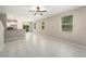 Spacious living room with tile flooring and large windows, providing ample natural light at 23378 Papyrus Way, Lutz, FL 33549