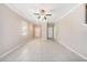 Bright and airy living room with tile flooring and a neutral color palette at 23378 Papyrus Way, Lutz, FL 33549