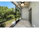 Inviting screened patio offers serene views of lush greenery and fresh air at 23378 Papyrus Way, Lutz, FL 33549